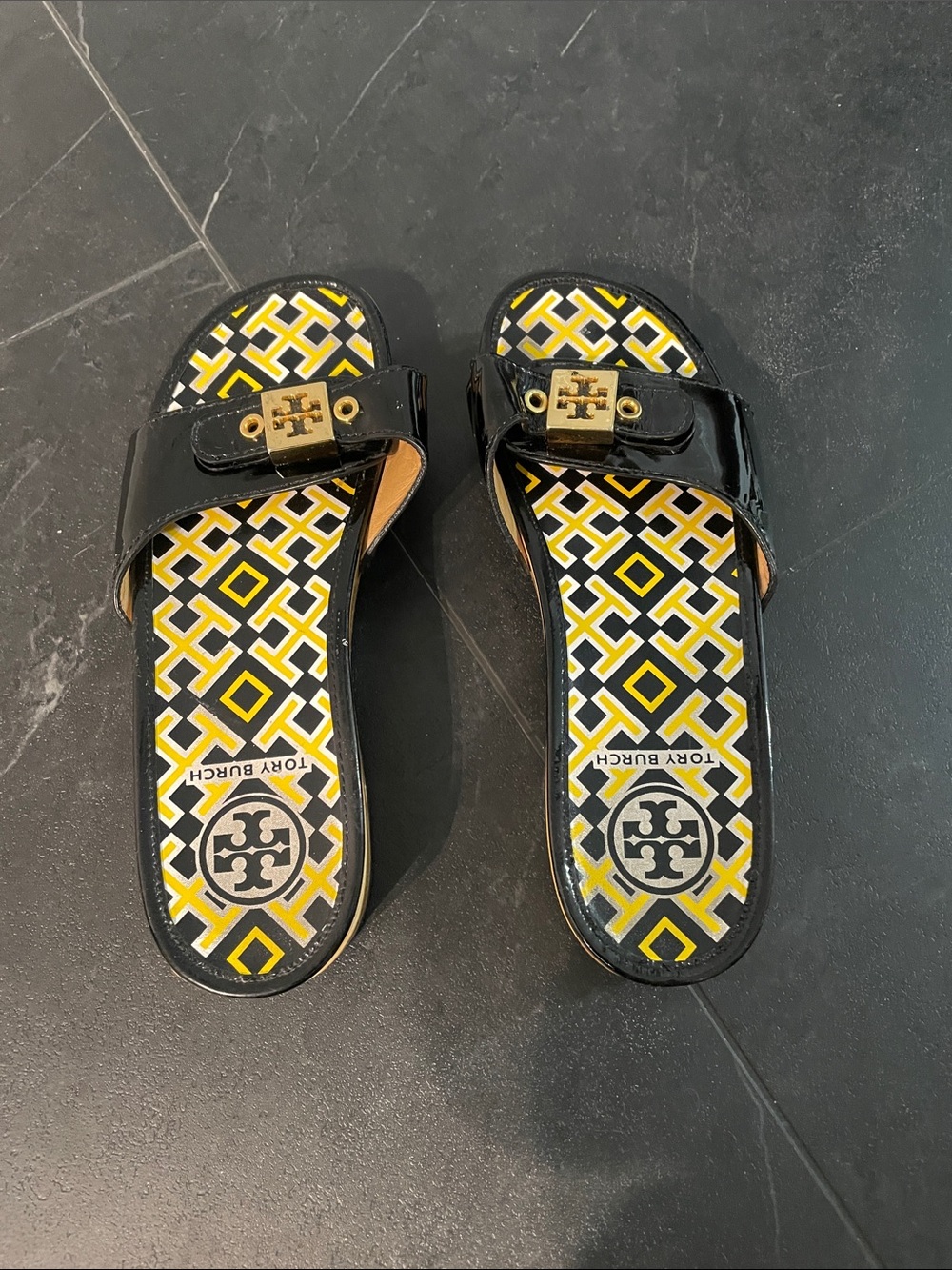 Tory Burch Black Patent Slide Sandals with Yellow Geometric Insole